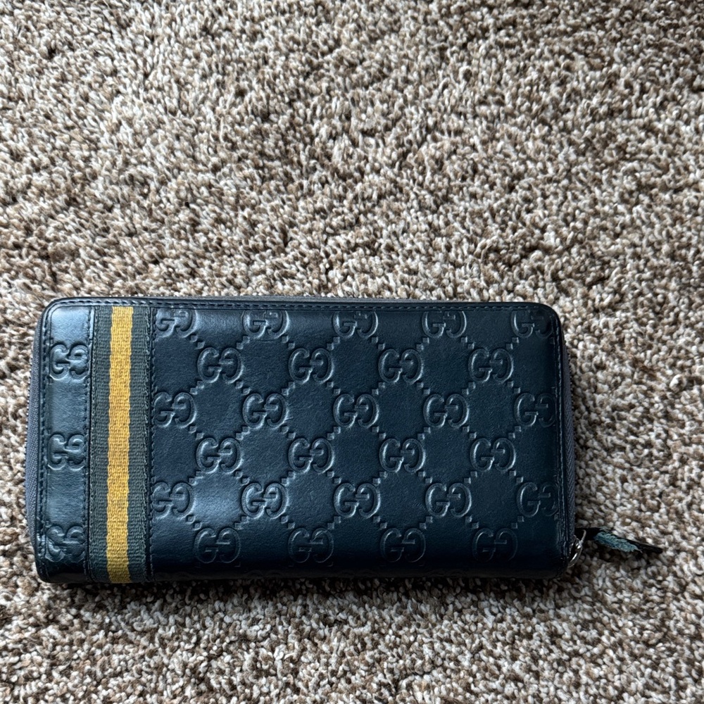 Gucci Embossed Black Wallet with Gold Accent